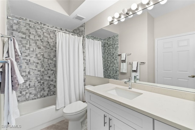 full bathroom with shower / tub combo, tile patterned flooring, vanity, and toilet