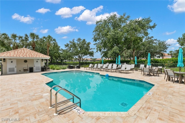 view of swimming pool with a patio area