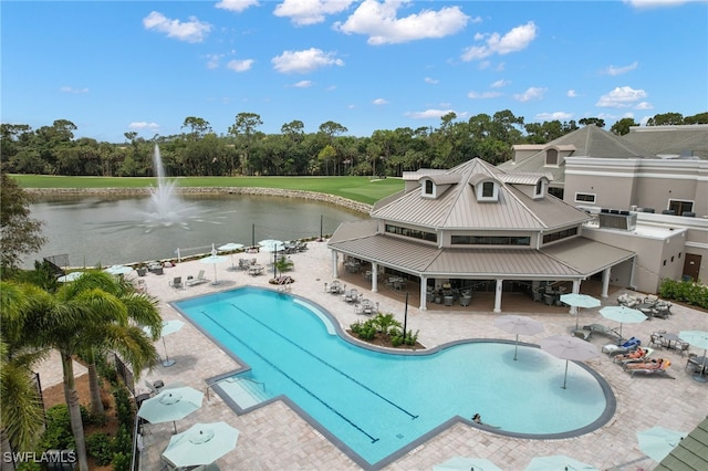 view of pool featuring a patio, a water view, and a gazebo