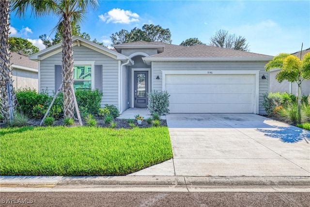 ranch-style home featuring a front lawn and a garage