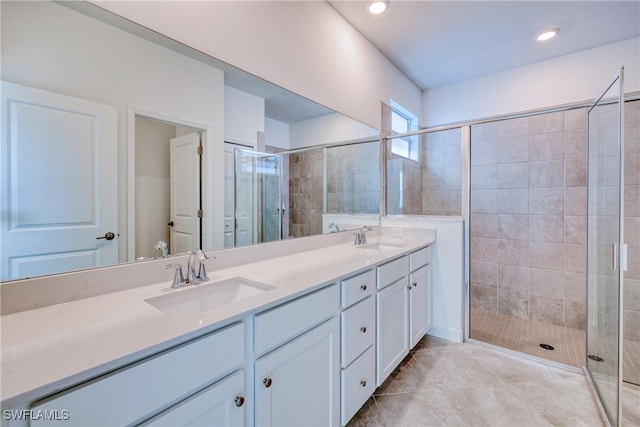 bathroom featuring vanity, tile patterned floors, and an enclosed shower