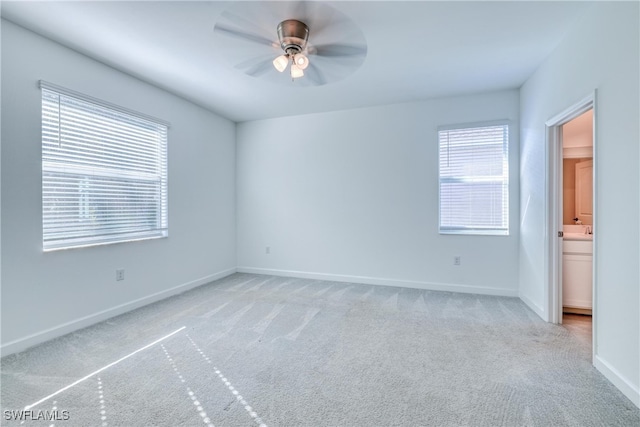 carpeted empty room with ceiling fan