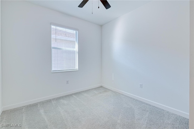 unfurnished room featuring ceiling fan and light carpet