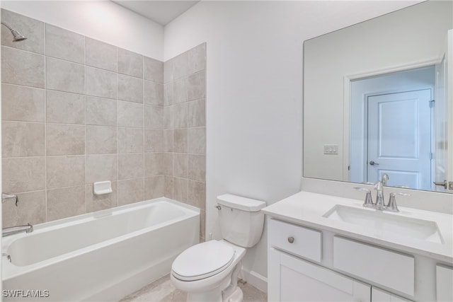 full bathroom with vanity, tiled shower / bath combo, and toilet