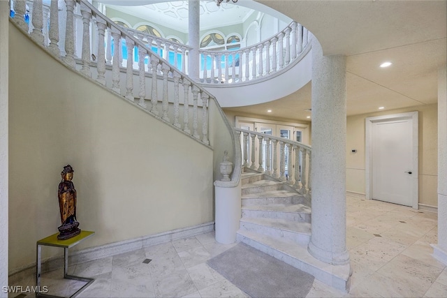 stairs with recessed lighting and baseboards