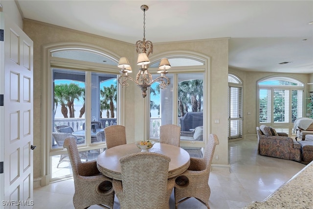 dining room featuring a chandelier and visible vents