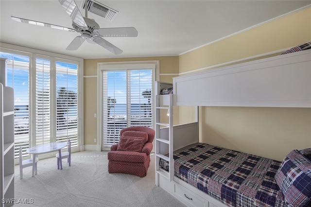 bedroom featuring access to exterior, visible vents, carpet floors, and multiple windows