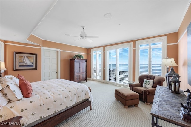 carpeted bedroom featuring a ceiling fan and access to outside