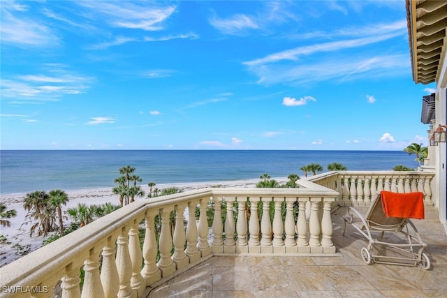 exterior space with a water view and a beach view