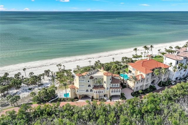 aerial view with a beach view and a water view