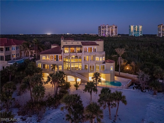 back of house with a balcony