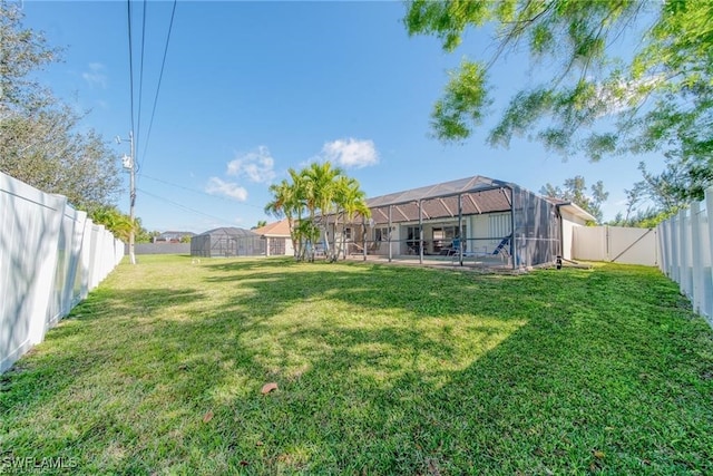 view of yard with a lanai