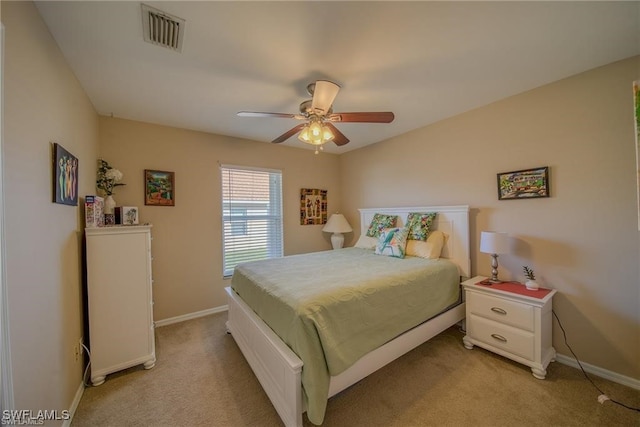 bedroom featuring ceiling fan and light carpet