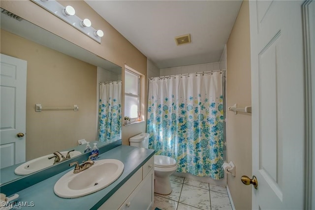 bathroom featuring vanity, toilet, and a shower with shower curtain