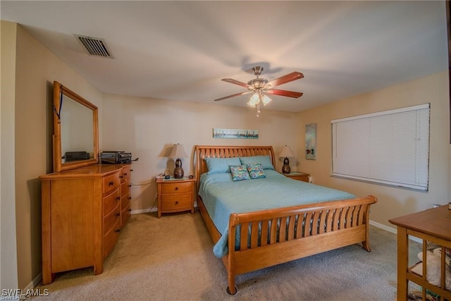 bedroom with ceiling fan and light colored carpet