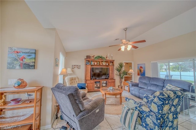 tiled living room with lofted ceiling and ceiling fan