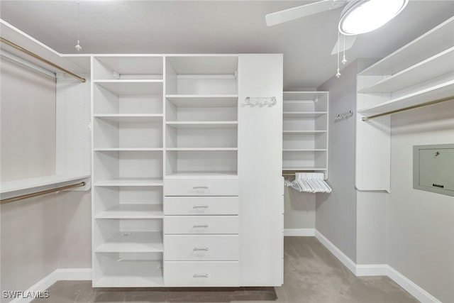 walk in closet featuring ceiling fan