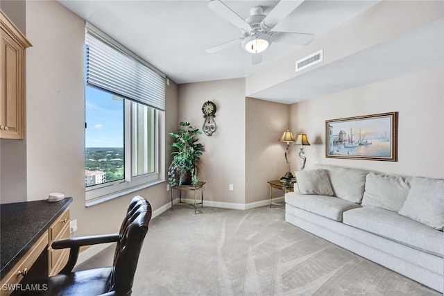 living room featuring light carpet and ceiling fan