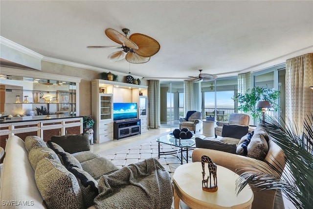 tiled living room with ornamental molding, ceiling fan, and expansive windows