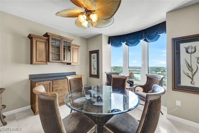 dining space featuring ceiling fan