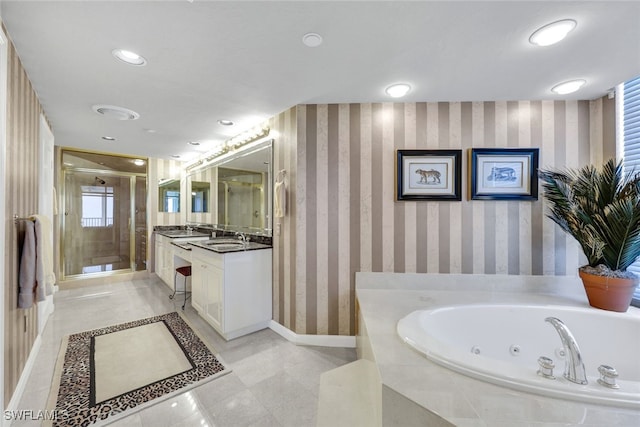 bathroom featuring vanity and separate shower and tub