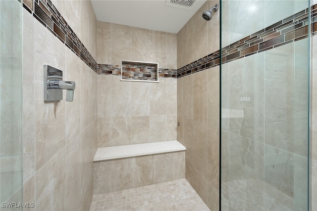 bathroom featuring a tile shower