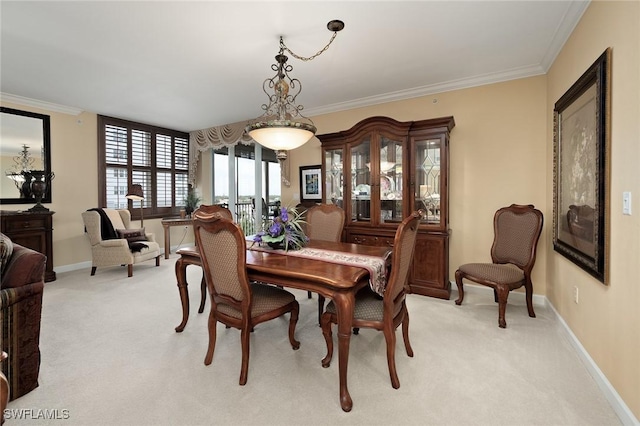 14250 Royal Harbour Ct Unit 817, Fort Myers, FL 33908 - dining space with light colored carpet, crown molding, and baseboards