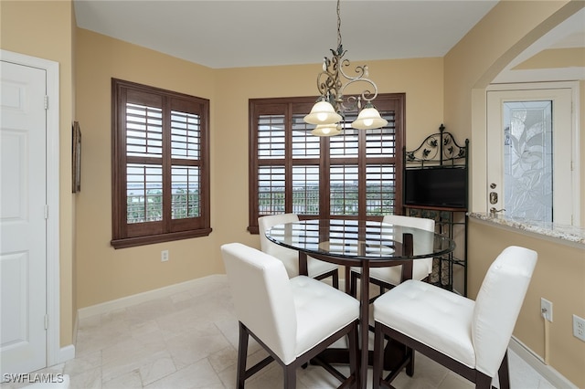 dining room featuring a notable chandelier