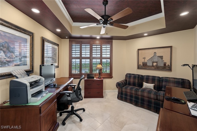 office featuring ceiling fan, a raised ceiling, and crown molding