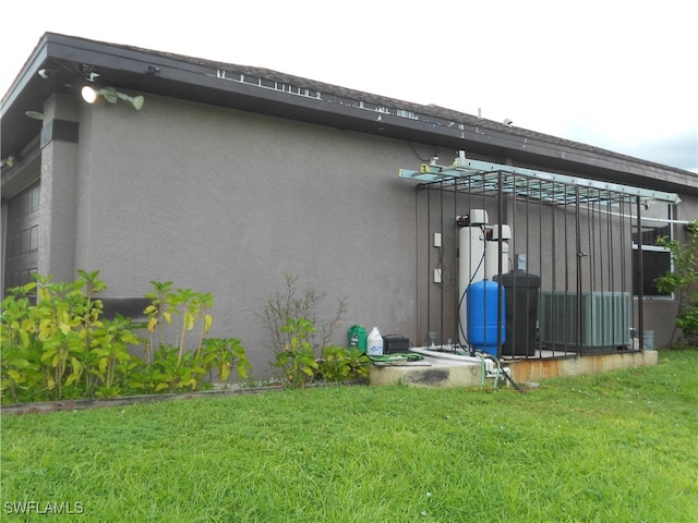 view of home's exterior with a lawn