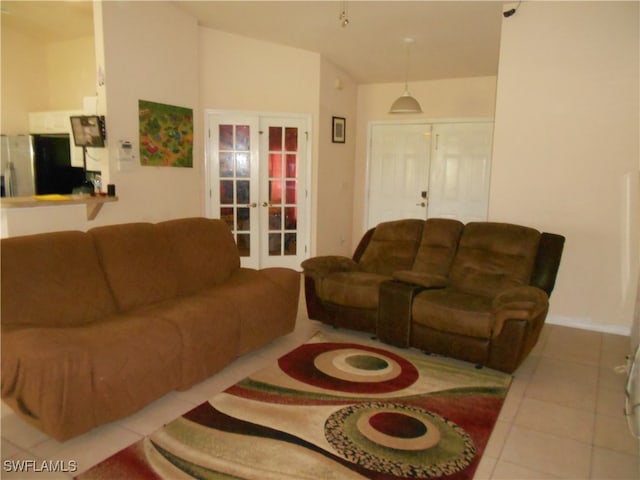 living room with tile patterned floors and french doors