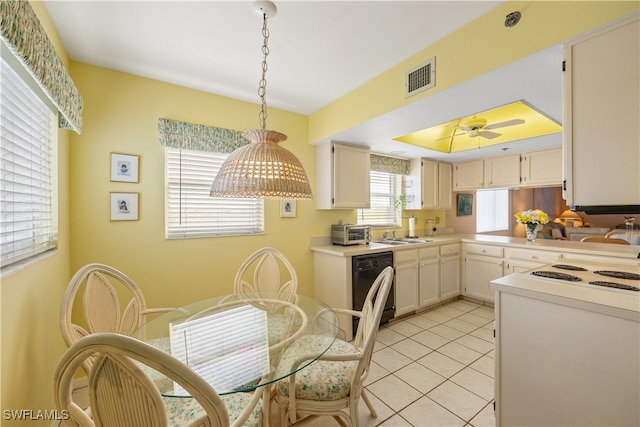 kitchen with ceiling fan, sink, light tile patterned floors, decorative light fixtures, and black dishwasher