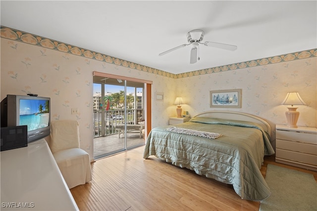 bedroom featuring ceiling fan, light hardwood / wood-style flooring, and access to exterior