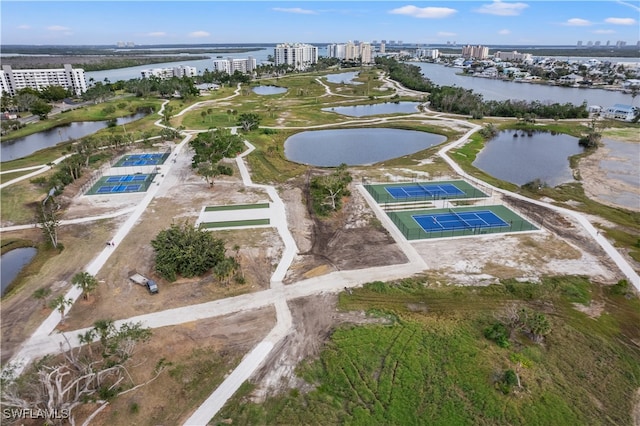 birds eye view of property with a water view