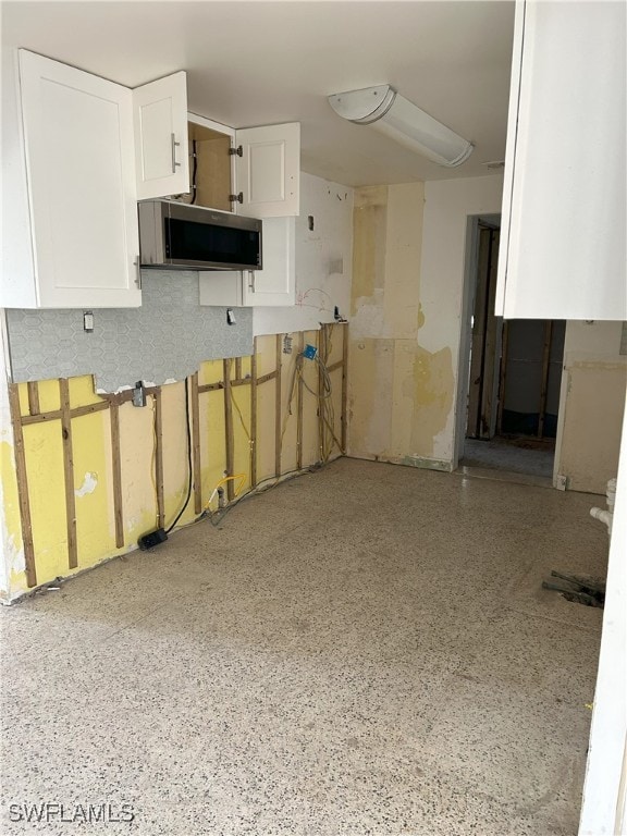 kitchen featuring white cabinetry