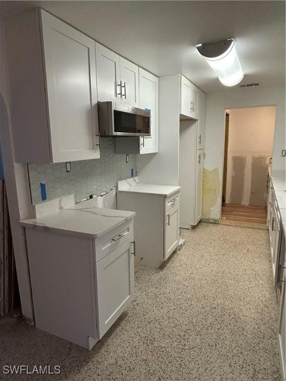 kitchen featuring white cabinetry