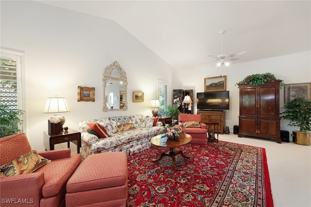 living room featuring light colored carpet, high vaulted ceiling, and ceiling fan