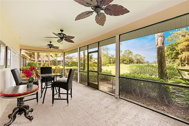 sunroom / solarium with ceiling fan