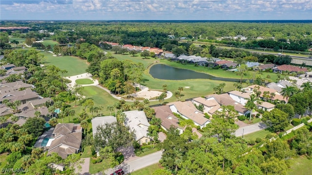 drone / aerial view with a water view, view of golf course, and a residential view