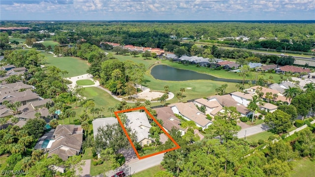 birds eye view of property with view of golf course, a residential view, and a water view