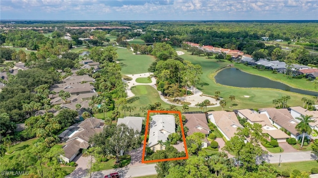 birds eye view of property featuring a water view, view of golf course, and a residential view