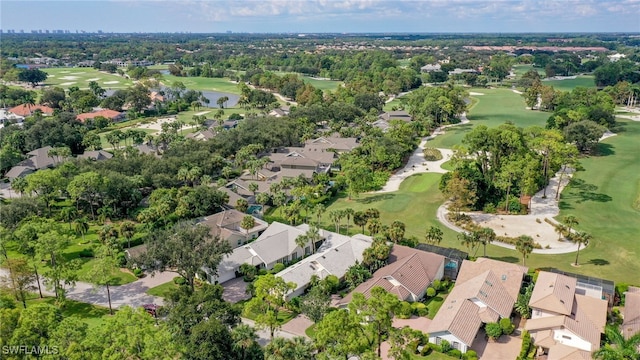 birds eye view of property with golf course view, a residential view, and a water view