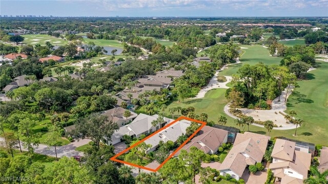 birds eye view of property with a residential view, view of golf course, and a water view