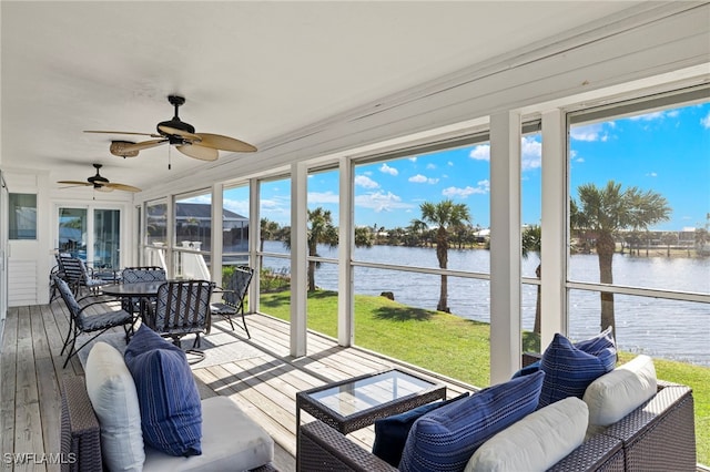 3311 Twin Lakes Ln, Sanibel, FL 33957 - sunroom featuring a water view, outdoor dining area, and ceiling fan