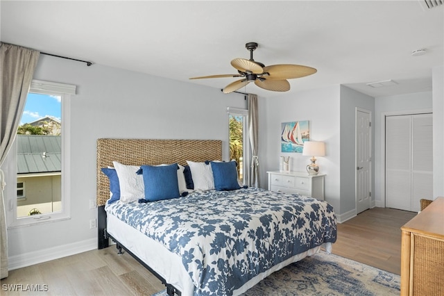 bedroom featuring light hardwood / wood-style flooring and ceiling fan