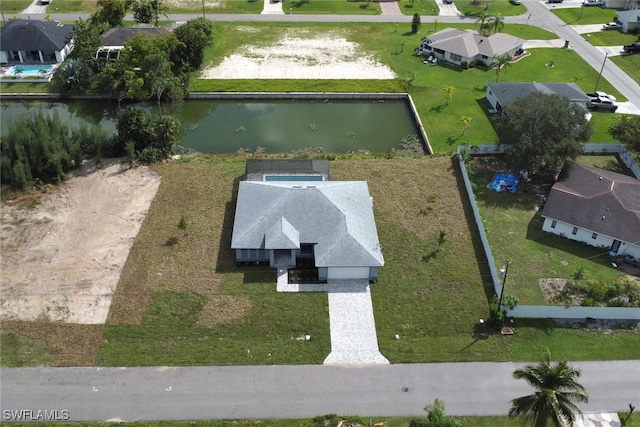 drone / aerial view with a water view