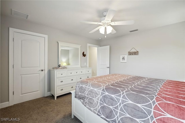 bedroom with ceiling fan and dark colored carpet