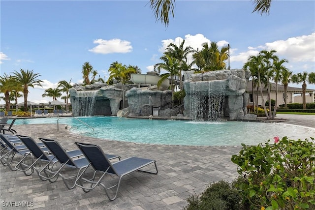 view of pool featuring pool water feature