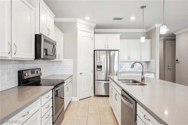 kitchen featuring stainless steel appliances, pendant lighting, white cabinets, and sink