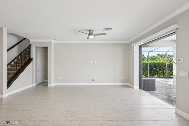 spare room with ceiling fan, light tile patterned flooring, and crown molding